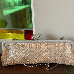 Coach clutch purse with detachable shoulder strap.